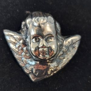 Silver cherub brooch/pendant.
